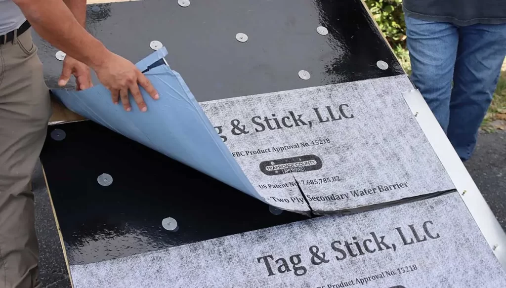 customer examining roof underlayment